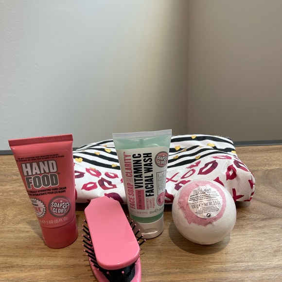 Make up bag with hand lotion, face wash, brush, and bath bomb. New with tags - Picture 2 of 3